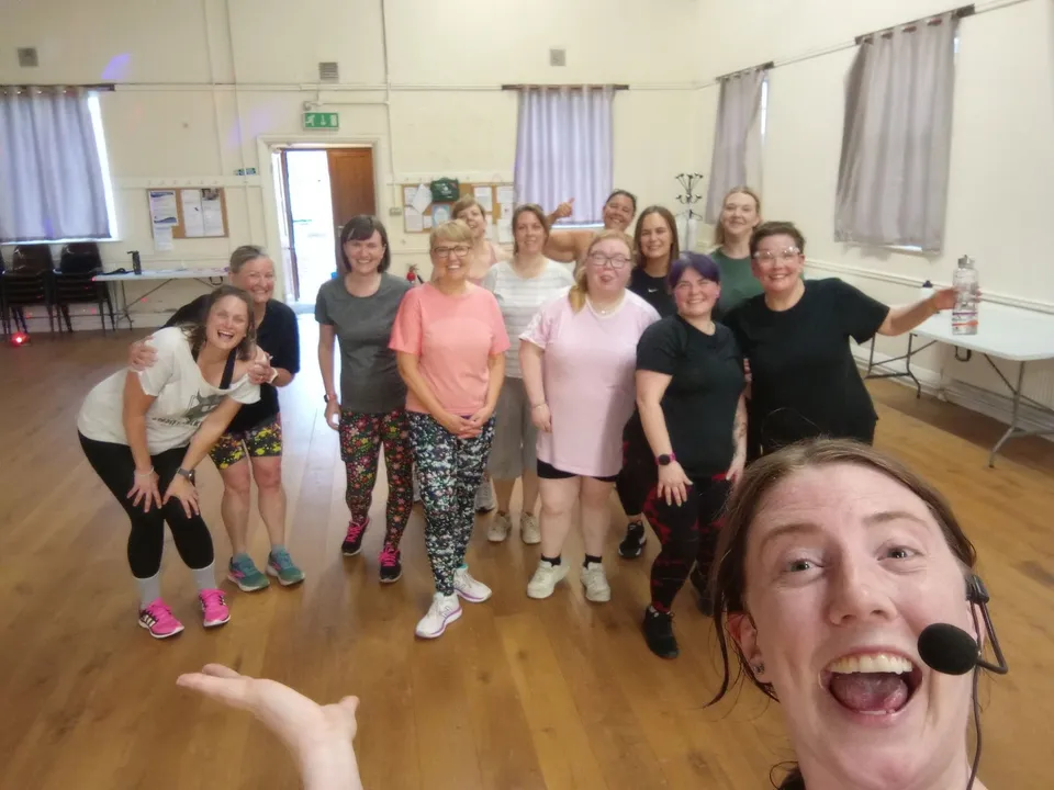 Liv and class members smiling together after a session